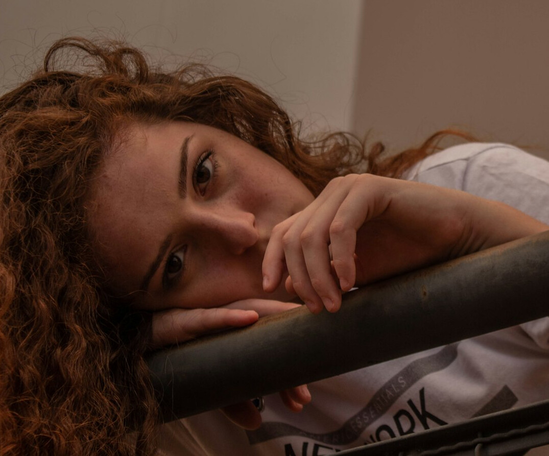 Portrait of a young woman with curly hair