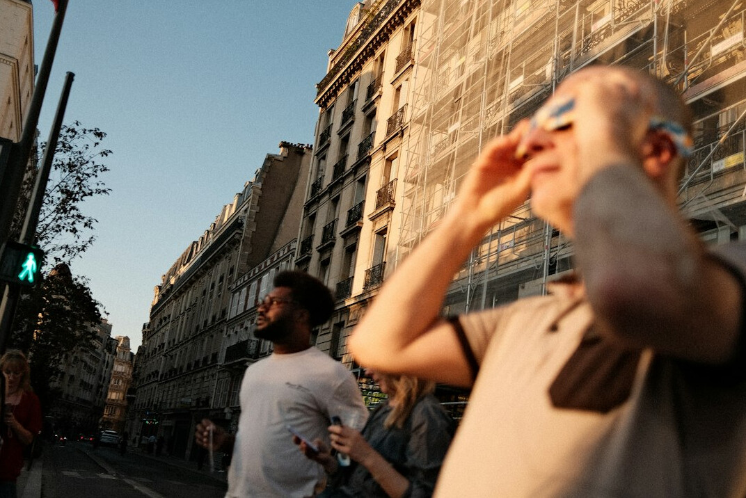 Documentary photographer taking photos on a city street