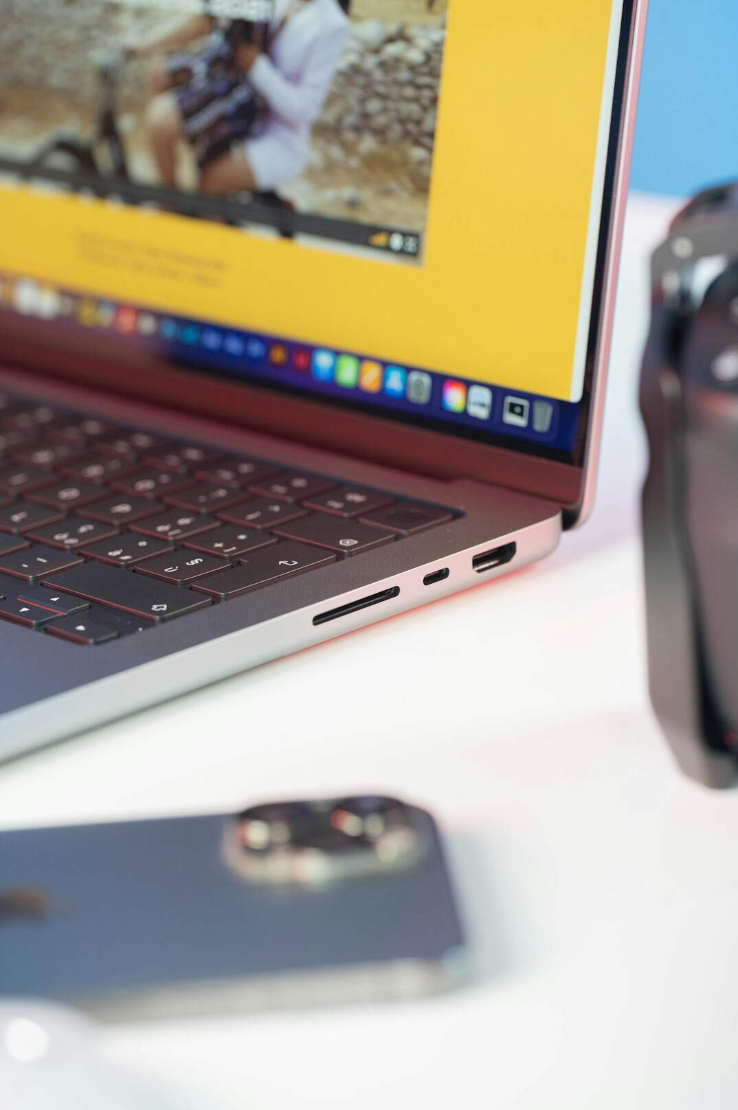 Photo editor retouching images on a laptop